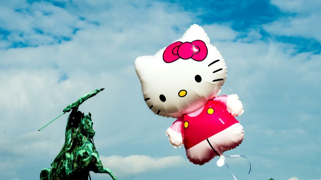 hello kitty balloon on tree branch
