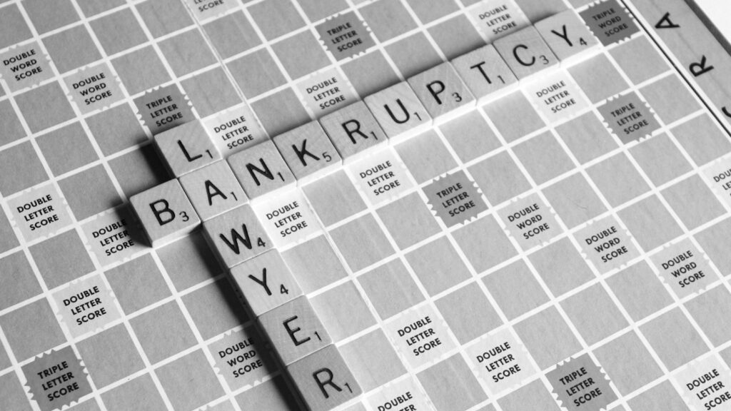 gray scale photography of Lawyer Bankruptcy scrabbles tiles